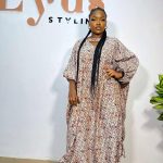 Stylish brown maxi African dress crafted from authentic African print, showcasing rich cultural patterns and elegant design.