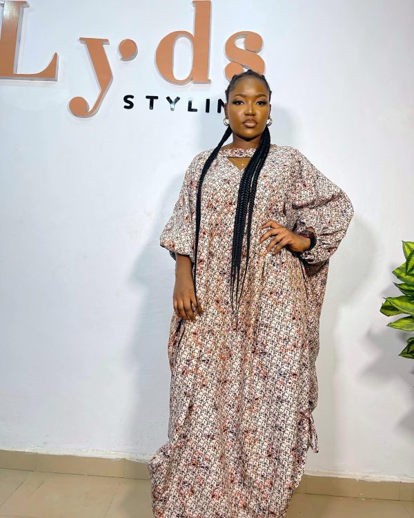 Stylish brown maxi African dress crafted from authentic African print, showcasing rich cultural patterns and elegant design.