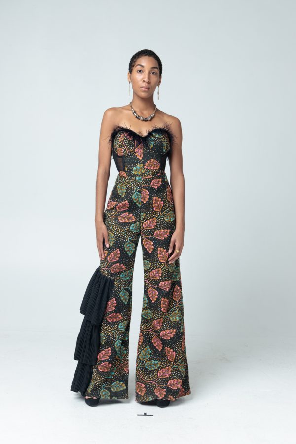 A Floral Patterned Ankara Jumpsuit. Pleated ruffles on the right side. Feathers around cleavage. Corset Style; Comes with an adjustable, detachable strap.