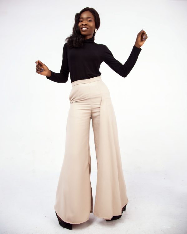 Elevate your style with this high waist cream-colored peridot palazzo pants. Discover comfort and elegance in one piece. Shop now for timeless fashion.