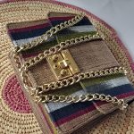 Enhance your fashion game with our mini clutch featuring African-inspired multicolored stripes. Uniquely chic, versatile, and vibrant. Explore now