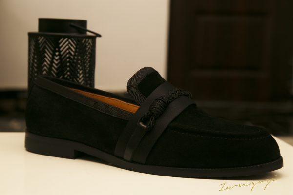 Elevate your style with Zuri black suede loafers featuring chic knot details. Classic comfort meets trendy sophistication for any event. Shop now!