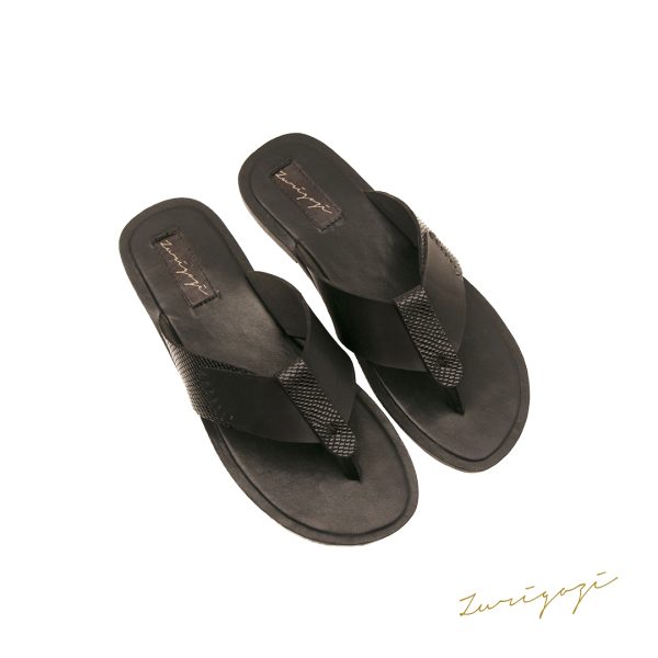 Discover ultimate comfort and style with our sleek black men's slippers. Elevate your loungewear game today. Shop this stunning leather slippers now!