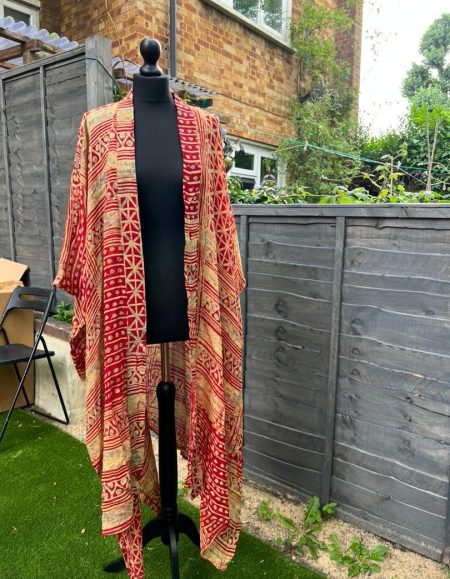 Elevate your style with our vibrant orange African print Aries Kimono for women. Embrace the bold, cultural elegance and spruce up your wardrobe. Shop now!