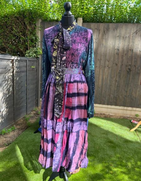 Discover the vibrant beauty of our multicolored Adire maxi African dress collection. Embrace culture, style, and elegance in every step. Shop now!