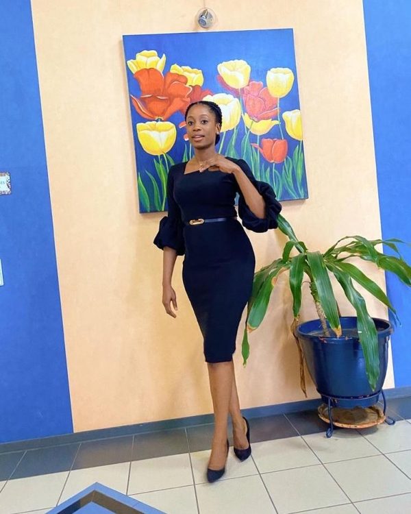 A corporate knee length dress with an Asymmetrical neckline and a straight and puff sleeve. A dress that meets the standard of diverse occasions.
