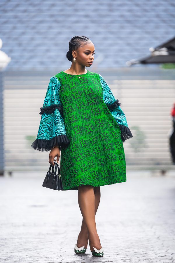 A blue and green short Ankara dress, with nets on the sleeves. Perfect for an outing, the office and any event. Step out in style and command your respect!