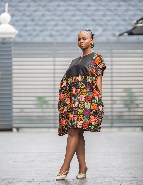 Elevate your style with our knee-length dress, adorned with a captivating design. Perfect for a stunning look. Get yours now!