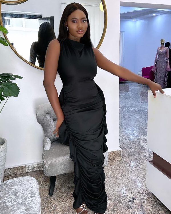 "Elevate your style with the Yaya Dress – a stunning black ruffled maxi dress that exudes sophistication and charm. Shop this timeless classic today."