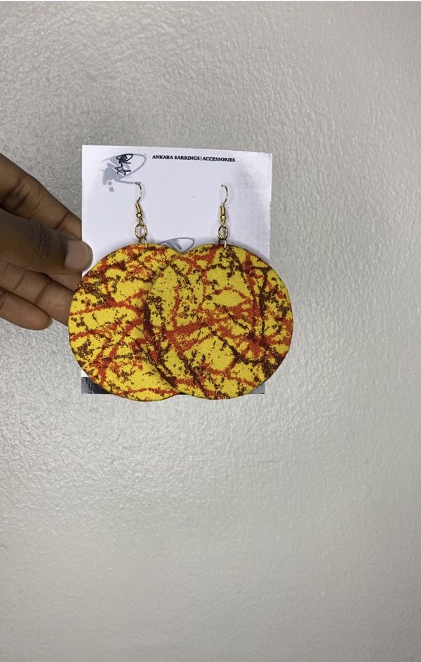 Discover unique round-shaped Ankara earrings, handcrafted with vibrant fabric patterns. Elevate your style with these culturally inspired accessories.