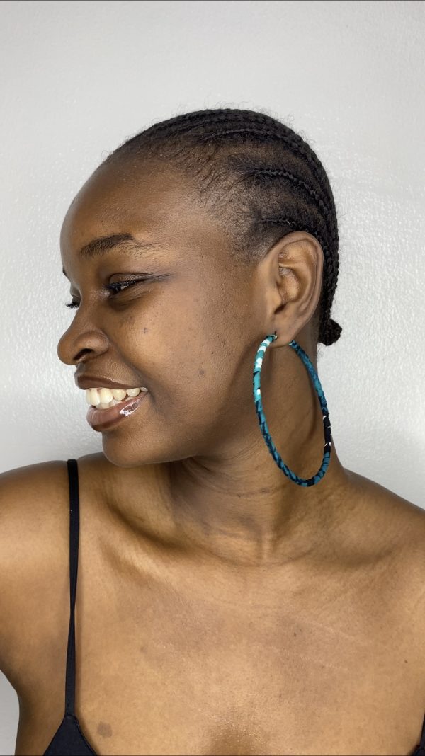 Elevate your look with these vibrant Ankara hoop earrings in dazzling colors. Perfect for any outing, these earrings will add a pop of color and flair.