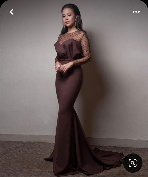 Step into the spotlight with our "Boss Lady" Brown Plain Dress featuring a fancy net neckline. Designed to accentuate curves, this dress exudes elegance and confidence, making it perfect for formal occasions. Flaunt your sophistication with its flattering silhouette and intricate net detailing, sure to captivate attention wherever you go.