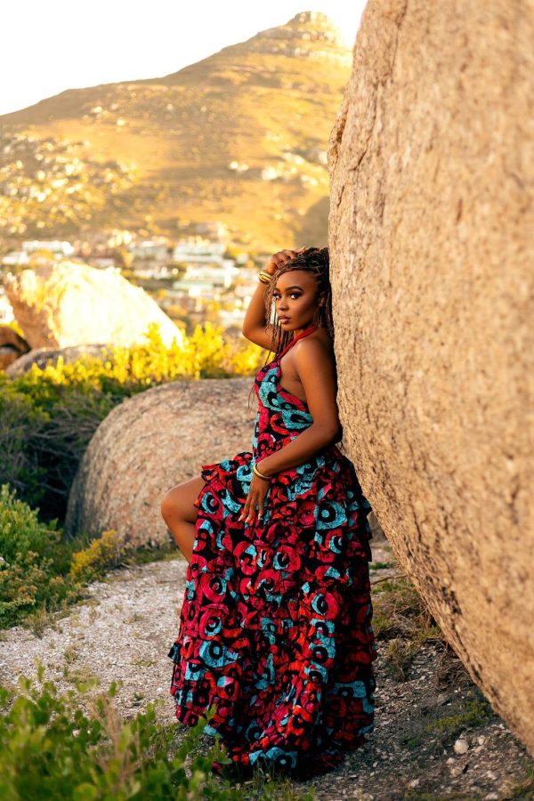 Celebrate elegance and cultural heritage with the Queen Moremi dress, crafted from vibrant Ankara prints. This flowing, floor-length gown features bold patterns and a flattering halter neckline, perfectly combining sophistication and tradition. Designed to make a statement, the Queen Moremi dress is ideal for occasions where style and grace are paramount.